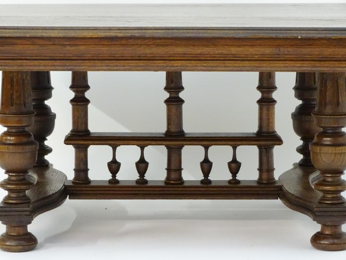 A 20thC oak table with a rectangular moulded top, four turned tapering legs with fluted decoration - Bild 6 aus 6