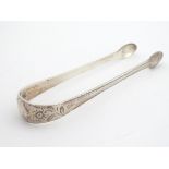 18thC silver sugar tongs with bright cut decoration. Maker GS ( probably George Smith II) 5" long (