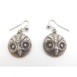 A pair of silver drop earrings with owl head decoration. Marked Sterling VS Approx 1" long Please