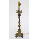 A late 19th / early 20thC cast table lamp with castellated top. Approx. 19 1/2" high overall. Please