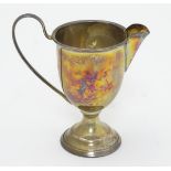 A silver cream jug hallmarked Birmingham 1926 maker Henry Moreton 3 3/4" high (50g) Please Note - we