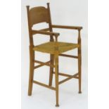 A C.1900 William Birch childs chair with turned tapering uprights and ring turned detailing,