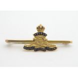 A 9ct gold brooch with enamel decorated Royal Artillery insignia 1 3/4" wide Please Note - we do not
