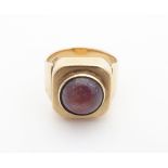 A vintage retro 9ct gold dress ring set with star ruby cabochon the setting approx 1/" wide. Ring