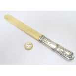A late 19thC / early 20thC French silver handled page turner with ivory blade. Marker mark for