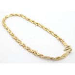 A 9ct gold rope twist bracelet. Approx 7" long (2.5g) Please Note - we do not make reference to