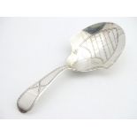 A Geo III silver caddy spoon hallmarked Birmingham 1797 with double duty mark, maker IT. 3 1/2" long