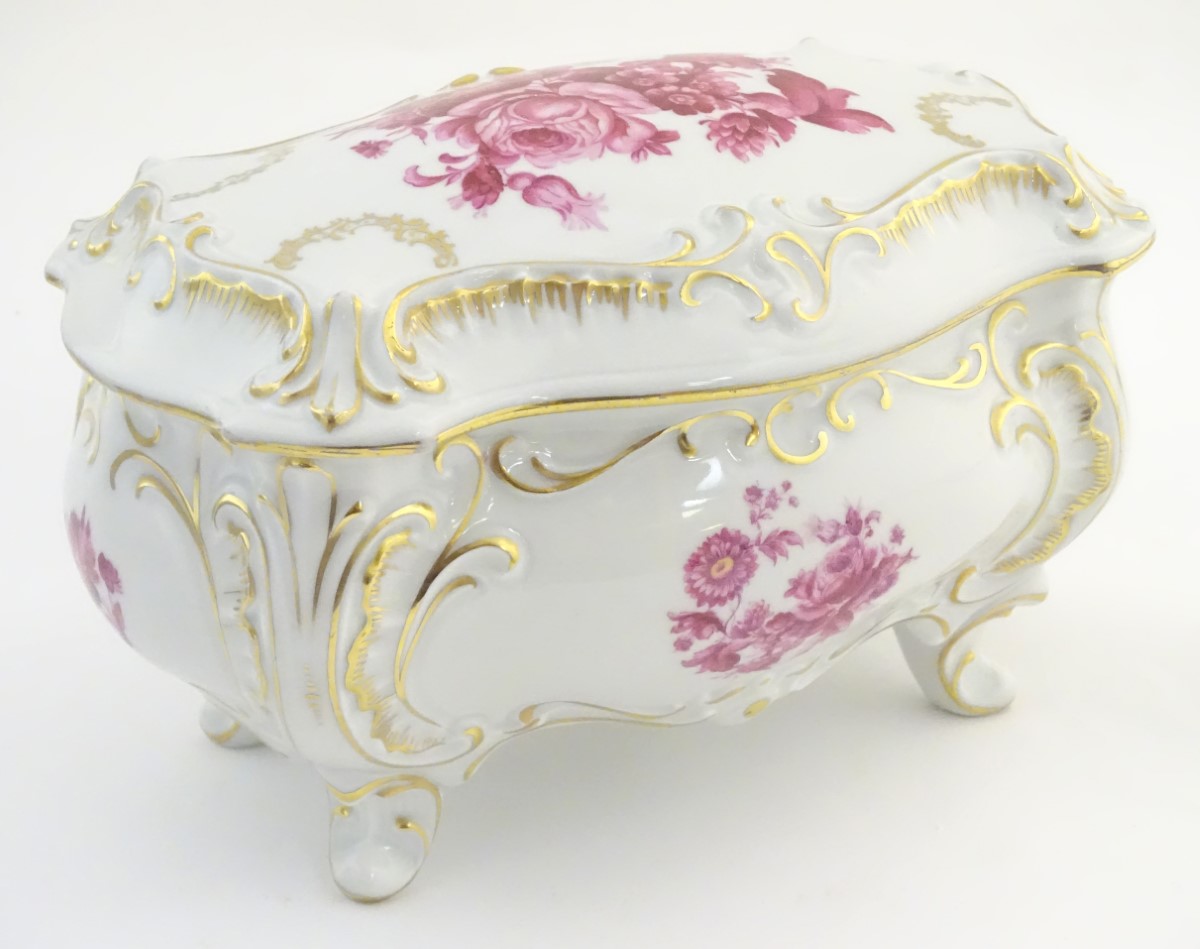 A German Graf von Henneberg porcelain casket and cover decorated with pink flowers and foliage and