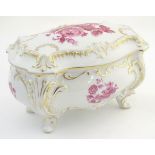 A German Graf von Henneberg porcelain casket and cover decorated with pink flowers and foliage and