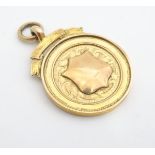 A 9ct gold fob medal by J W Tiptaft Birmingham, inscribed 'Wilts League Champions 1928-9'. total