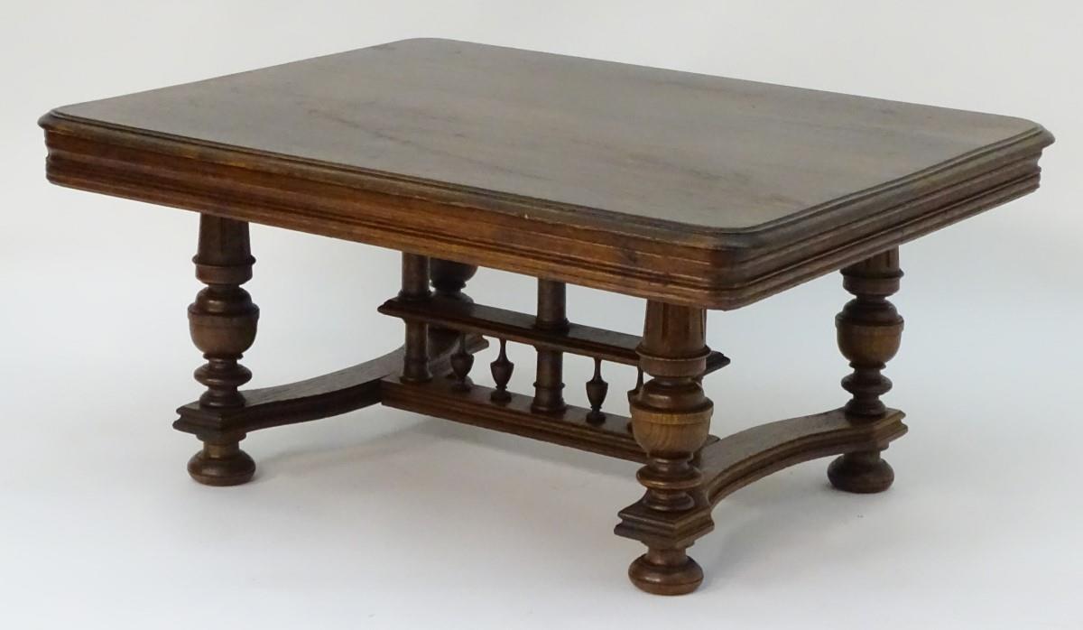 A 20thC oak table with a rectangular moulded top, four turned tapering legs with fluted decoration - Bild 3 aus 6