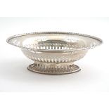 A silver dish of oval form with pierced decoration. Hallmarked London 1932 maker Richard Comyns.