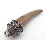 A Victorian pendant formed as a boars tooth mounted within a .800 German silver mount with oak