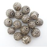 14 assorted white metal beads with various acanthus scroll and scrolling dragon decoration. The