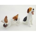 Two Royal Doulton dogs, a seated Jack Russell yawning, model number 1099 and a Jack Russell