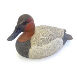 A 21stC American life-sized hand carved, hand painted wooden decoy duck, with inset glass eyes,
