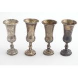 A matched set of 4 silver Jewish kiddish cups. Hallmarked Birmingham 1906/1907 maker Jacob