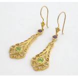 A pair of silver gilt drop earrings set with amethyst, peridot and seed pearls. Approx 2 1/4" long