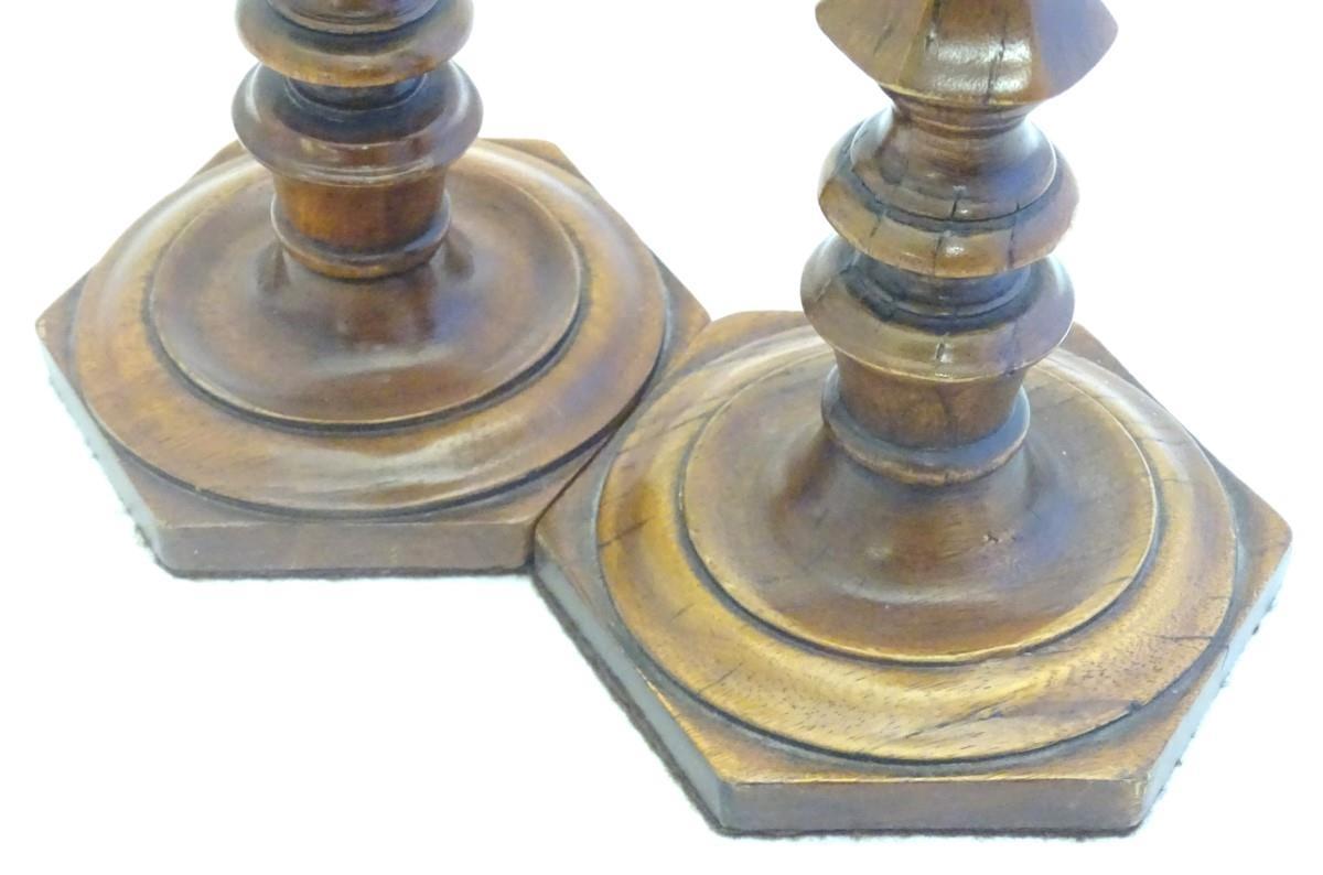 Treen: A pair of 19thC turned and carved wooden candlesticks with hexagonal bases. Approx. 10 3/4" - Image 2 of 8