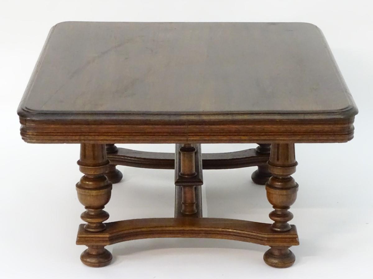 A 20thC oak table with a rectangular moulded top, four turned tapering legs with fluted decoration - Bild 4 aus 6