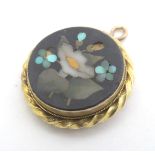 Grand Tour jewellery : A gold pendant set with pietra dura decoration ( unmarked - tests as 15ct