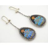 A pair of vintage Sterling Silver drop earrings set with image of a girl in a crinoline style