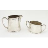 Militaria: a silver plated cream jug and sugar bowl by Mappin & Webb, stamped 'KF.18074' (jug), KF.