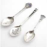 Three assorted silver teaspoons including a Gold related spoon titled St. M G C. another