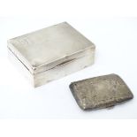 A silver table top cigarette box with engine turned decoration hallmarked Birmingham 1936 maker F