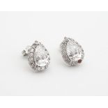 A pair of silver stud earrings set with cubic zirconia Please Note - we do not make reference to the