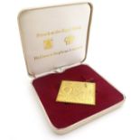 A cased postage stamp 22ct gold ingot by Hallmark Replicas Ltd, commemorating the Postal Union