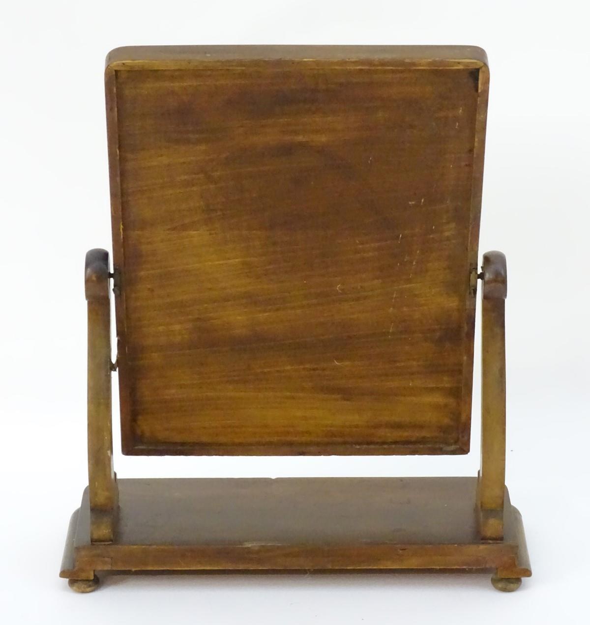 An early / mid 19thC mahogany toilet / dressing mirror with scrolled supports and a rectangular - Image 2 of 6