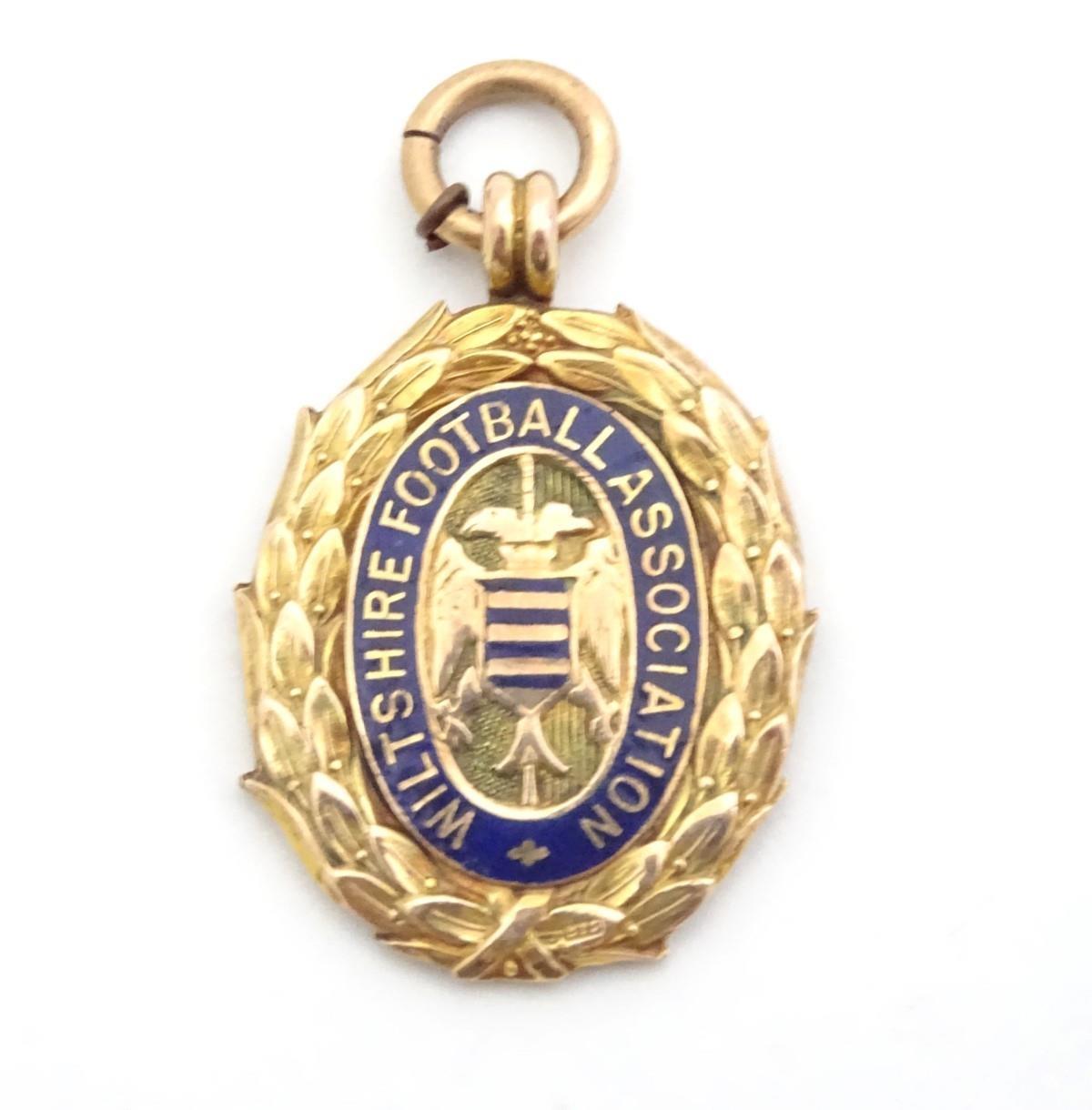 A 9ct gold fob medal with enamelled Wiltshire Football Association emblem. Total weight 8g Please - Image 12 of 13
