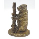 A brass novelty go-to-bed vesta formed as the Warwickshire bear with ragged staff. Approx. 3"