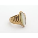 A 9ct gold ring set with mother of pearl lozenge in an Art Deco setting. ( Ring size approx L 1/2)
