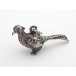 A Victorian Continental white metal pendant formed as a pheasant / bird. Probably German /