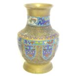 A Japanese brass vase of baluster form with Cloisonné mask and shield decoration to sides. Approx. 9