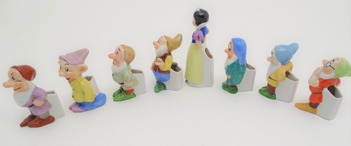 A mid-20thC ceramic novelty set of bud vases, formed as Snow White and the seven Dwarves. The - Image 4 of 9