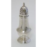 A silver caster hallmarked Birmingham 1996 maker Bishtons Ltd. Approx 5 3/4" high (84g) Please