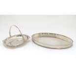 A silver plated oval tray with galleried side together with a cake basket with swing over handle.