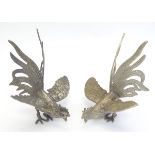 A pair of silver plated fighting cockerels. Approx. 5 1/4" high. (2) Please Note - we do not make