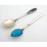 A silver tea spoon having turquoise guilloche enamel decoration to bowl, and white guilloche
