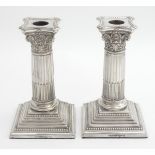 A pair of silver plate candlesticks of Corinthian column form. Approx 6" high Please Note - we do