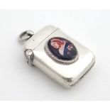 A Victorian silver vesta case hallmarked Birmingham 1892 with later applied ceramic cabochon