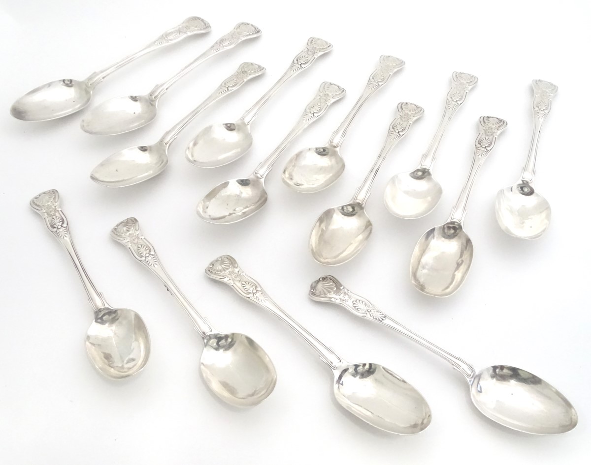 A set of 11 Geo IV silver kings pattern table spoons . Hallmarked London 1828 maker William