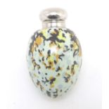A ceramic scent bottle formed as an egg. Approx. 2 1/4" high. Please Note - we do not make reference
