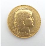 A French Republic 20 franc gold coin, 1908, approximately 6.5g Please Note - we do not make