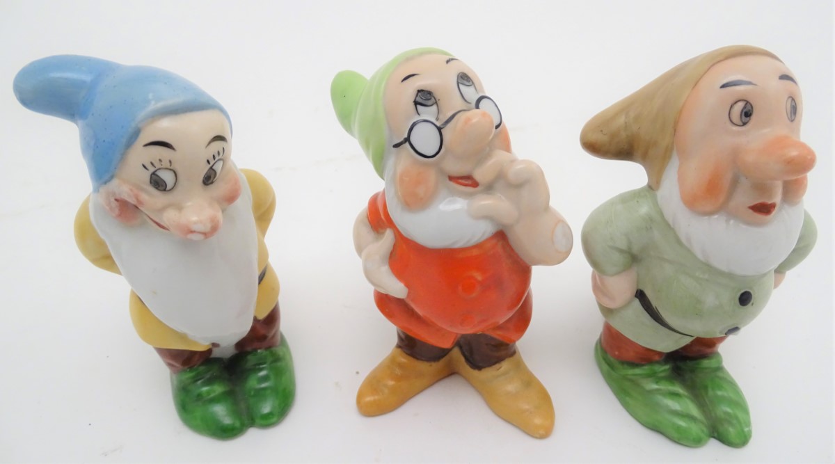 A mid-20thC ceramic novelty set of bud vases, formed as Snow White and the seven Dwarves. The - Image 8 of 9