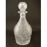 A cut glass decanter with diamond cut and banded decoration, 10 1/4'' high Please Note - we do not