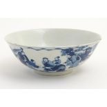 A Chinese blue and white bowl depicting figures in a landscape. Character marks under. Approx 2 3/